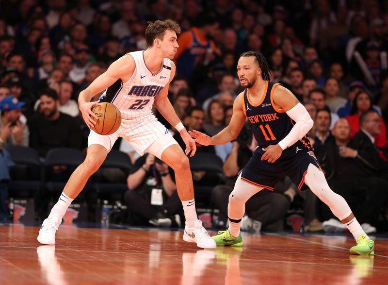 NEW YORK, NEW YORK - DECEMBER 03: Franz Wagner #22 of the Orlando Magic dribbles against Jalen Brunson #11 of the New York Knicks during their game at Madison Square Garden on December 03, 2024 in New York City.   User expressly acknowledges and agrees that, by downloading and or using this photograph, User is consenting to the terms and conditions of the Getty Images License Agreement.  (Photo by Al Bello/Getty Images)