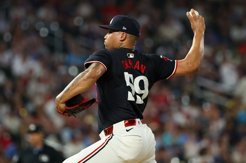 Aug 24, 2024; Minneapolis, Minnesota, USA; Minnesota Twins pitcher Jhoan Duran (59) delivers a pitch against the St. Louis Cardinals during the ninth inning at Target Field. Mandatory Credit: Matt Krohn-USA TODAY Sports