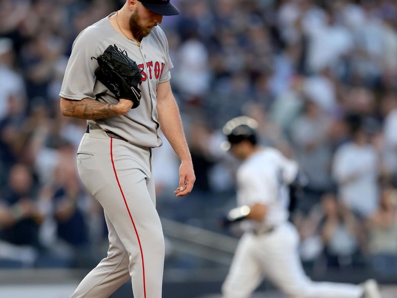 Jun 7, 2025; Bronx, New York, USA; Boston Red Sox starting pitcher Garrett Crochet (35) reacts as New York Yankees catcher Austin Wells (28) rounds the bases after hitting a three run home run during the second inning at Yankee Stadium. Mandatory Credit: Brad Penner-Imagn Images