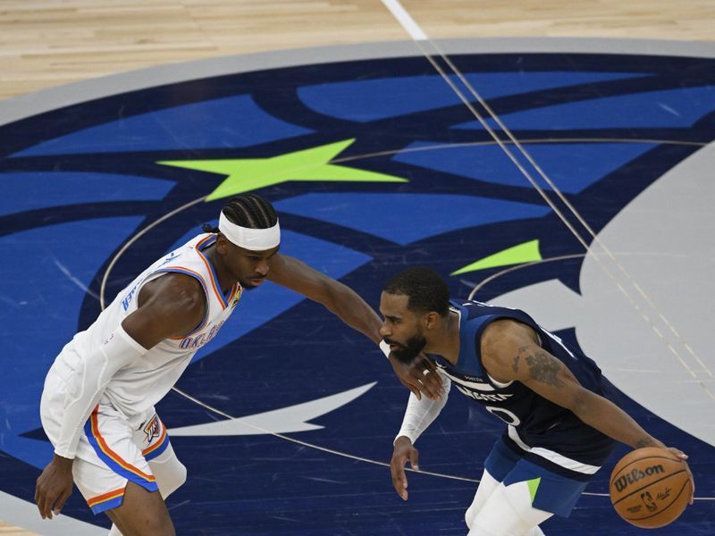 MINNEAPOLIS, MN -  MAY 25:  Mike Conley #10 of the Minnesota Timberwolves dribbles the ball during the game against Shai Gilgeous-Alexander #2 of the Oklahoma City Thunder  during Game Four of the Western Conference Finals on May 25, 2025 at Target Center in Minneapolis, Minnesota. NOTE TO USER: User expressly acknowledges and agrees that, by downloading and or using this Photograph, user is consenting to the terms and conditions of the Getty Images License Agreement. Mandatory Copyright Notice: Copyright 2025 NBAE (Photo by David Dow/NBAE via Getty Images)
