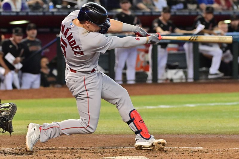 May 27, 2023; Phoenix, Arizona, USA;  Boston Red Sox shortstop Enrique Hernandez (5) hits an RBI single against the Arizona Diamondbacks in the fourth inning at Chase Field. Mandatory Credit: Matt Kartozian-USA TODAY Sports