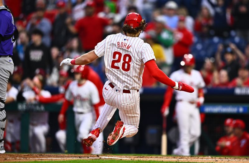 Apr 17, 2024; Philadelphia, Pennsylvania, USA; Philadelphia Phillies infielder Alec Bohm (28) slides home to score against the Colorado Rockies in the first inning at Citizens Bank Park. Mandatory Credit: Kyle Ross-USA TODAY Sports