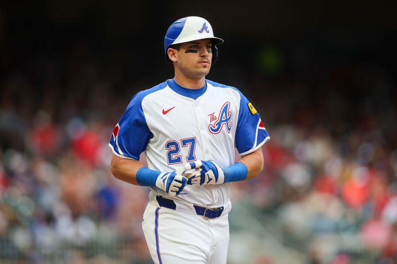 Jun 1, 2024; Atlanta, Georgia, USA; Atlanta Braves third baseman Austin Riley (27) runs to first after a walk against the Oakland Athletics in the first inning at Truist Park. Mandatory Credit: Brett Davis-USA TODAY Sports
