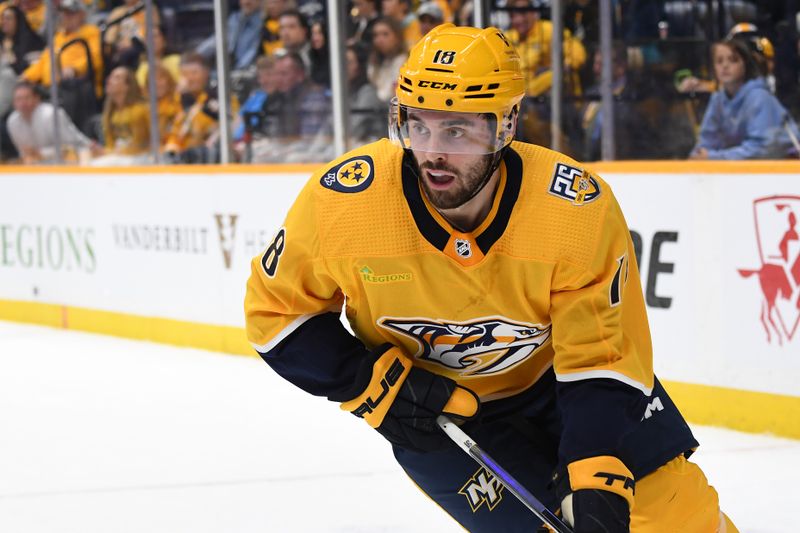 Nov 11, 2023; Nashville, Tennessee, USA; Nashville Predators center Liam Foudy (18) handles the puck during the first period against the Arizona Coyotes at Bridgestone Arena. Mandatory Credit: Christopher Hanewinckel-USA TODAY Sports