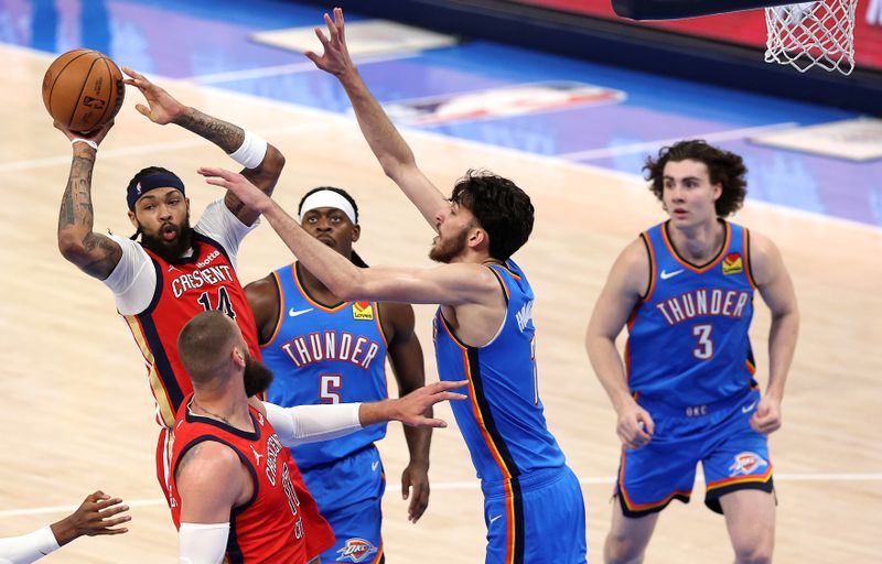 OKLAHOMA CITY, OKLAHOMA - APRIL 24:  Brandon Ingram #14 of the New Orleans Pelicans drives to the basket as Luguentz Dort #5, Chet Holmgren #7 and Josh Giddey #3 of the Oklahoma City Thunder defend during the first half of game two of the first round of the NBA playoffs at Paycom Center on April 24, 2024 in Oklahoma City, Oklahoma. (Photo by Jamie Squire/Getty Images)