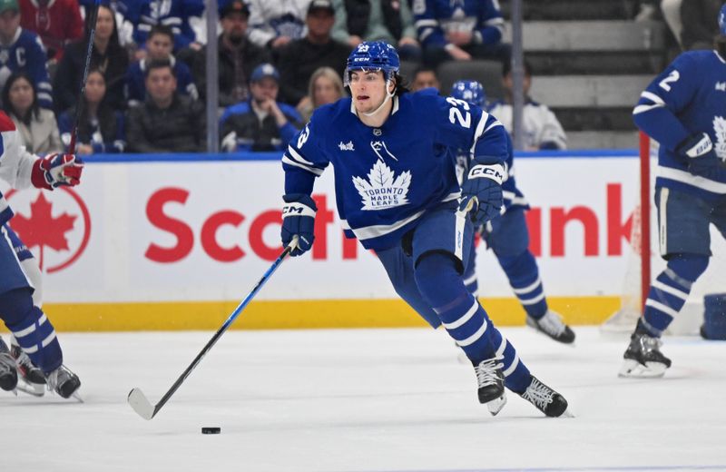 Apr 12, 2025; Toronto, Ontario, CAN;  Toronto Maple Leafs forward Matthew Knies (23) skates with the puck against the Montreal Canadiens in the third period at Scotiabank Arena. Mandatory Credit: Dan Hamilton-Imagn Images