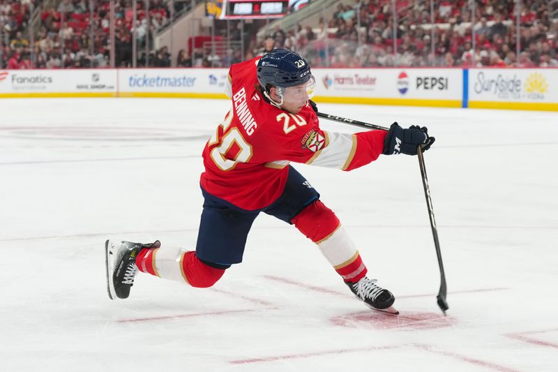 Sep 24, 2025; Raleigh, North Carolina, USA;  Florida Panthers defenseman Mike Benning (20) breaks his stick on his shot against the Carolina Hurricanes during the second period at Lenovo Center. Mandatory Credit: James Guillory-Imagn Images