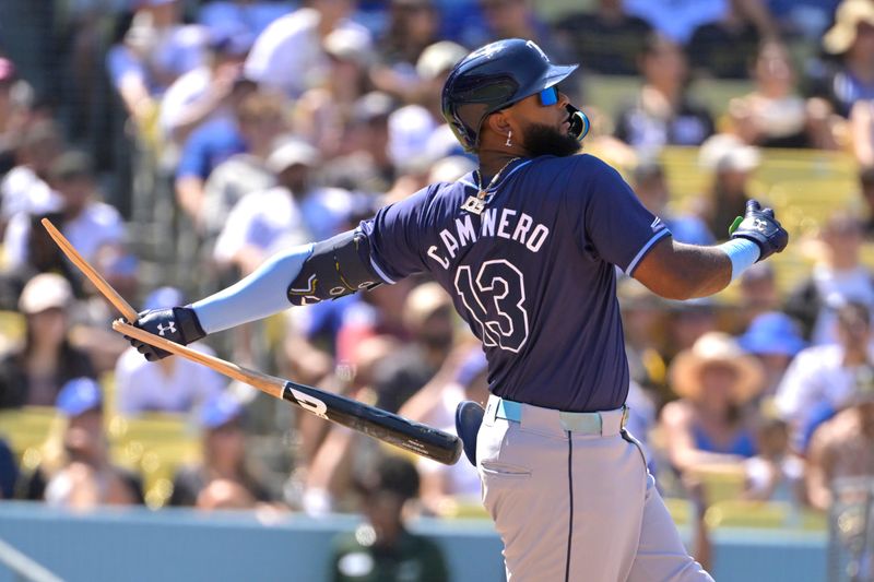 Aug 25, 2024; Los Angeles, California, USA;  Tampa Bay Rays third baseman Junior Caminero (13) breaks his bat on a ground out in the eighth inning against the Los Angeles Dodgers at Dodger Stadium. Mandatory Credit: Jayne Kamin-Oncea-USA TODAY Sports