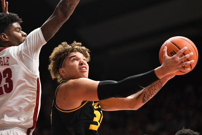 Jan 16, 2024; Tuscaloosa, Alabama, USA; Alabama forward Nick Pringle (23) defends a shot by Missouri forward Noah Carter (35) in the game at Coleman Coliseum. Mandatory Credit: Gary Cosby Jr.-USA TODAY Sports