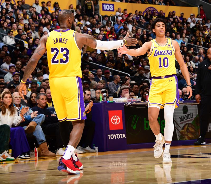 LOS ANGELES, CA - MARCH 18:  LeBron James #23 of the Los Angeles Lakers & Max Christie #10 of the Los Angeles Lakers high five during the game on March 18, 2024 at Crypto.Com Arena in Los Angeles, California. NOTE TO USER: User expressly acknowledges and agrees that, by downloading and/or using this Photograph, user is consenting to the terms and conditions of the Getty Images License Agreement. Mandatory Copyright Notice: Copyright 2024 NBAE (Photo by Adam Pantozzi/NBAE via Getty Images)