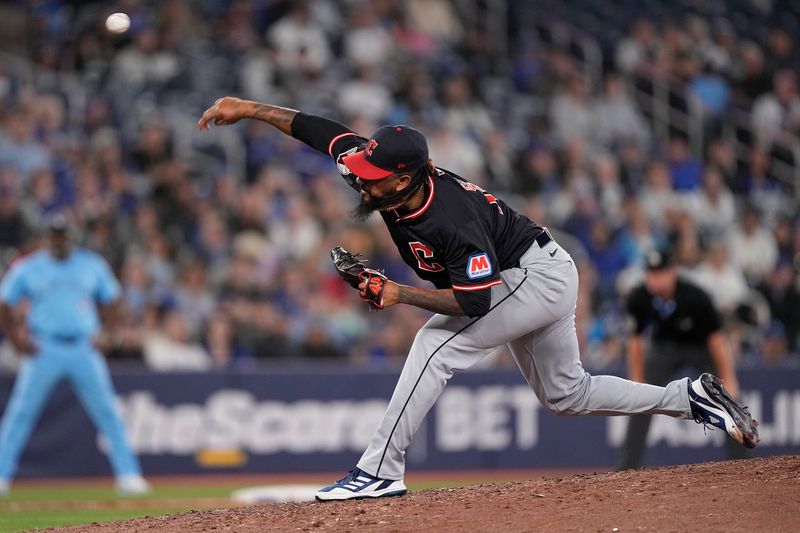 May 4, 2025; Toronto, Ontario, CAN; Cleveland Guardians pitcher Emmanuel Clase (48) pitches to the Toronto Blue Jays during the ninth inning at Rogers Centre. Mandatory Credit: John E. Sokolowski-Imagn Images
