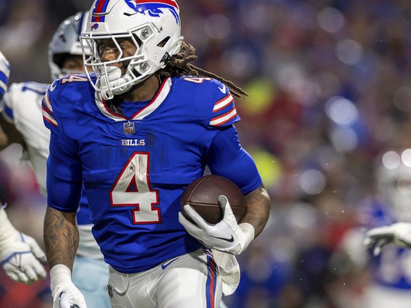 Buffalo Bills running back James Cook (4) runs the ball against the Dallas Cowboys in an NFL football game, Sunday, Dec. 17, 2023, in Orchard Park, NY. Bills defeated the Cowboys 31-10.(AP Photo/Jeff Lewis)