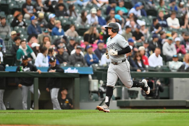 Jun 11, 2024; Seattle, Washington, USA; Chicago White Sox first baseman Andrew Vaughn (25) runs the bases after hitting a home run against the Seattle Mariners during the third inning at T-Mobile Park. Mandatory Credit: Steven Bisig-USA TODAY Sports