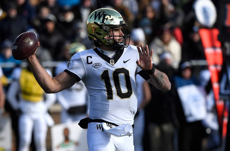 Nov 27, 2021; Chestnut Hill, Massachusetts, USA;  Wake Forest Demon Deacons quarterback Sam Hartman (10) throws a pass during the first half against the Boston College Eagles at Alumni Stadium. Mandatory Credit: Bob DeChiara-USA TODAY Sports