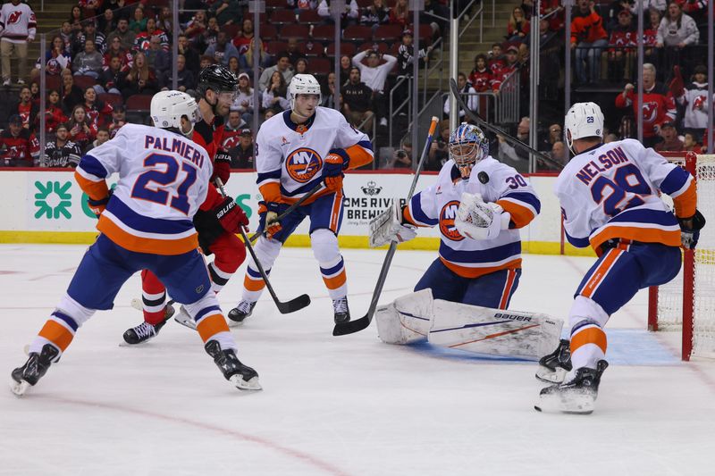 Oct 25, 2024; Newark, New Jersey, USA; New York Islanders goaltender Ilya Sorokin (30) makes a save against the New Jersey Devils during overtime at Prudential Center. Mandatory Credit: Ed Mulholland-Imagn Images