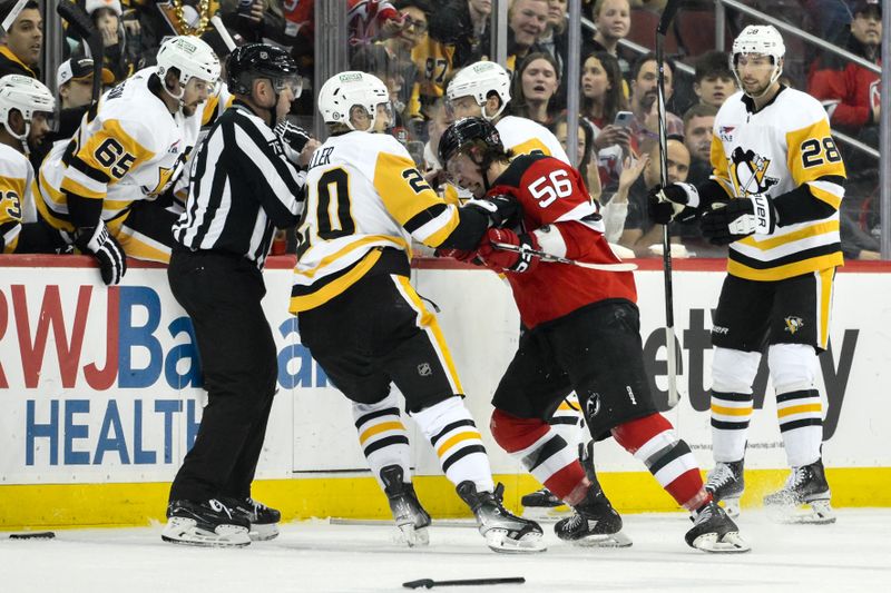 Apr 2, 2024; Newark, New Jersey, USA; Pittsburgh Penguins center Lars Eller (20) tussles with New Jersey Devils left wing Erik Haula (56) during the third period at Prudential Center. Mandatory Credit: John Jones-USA TODAY Sports