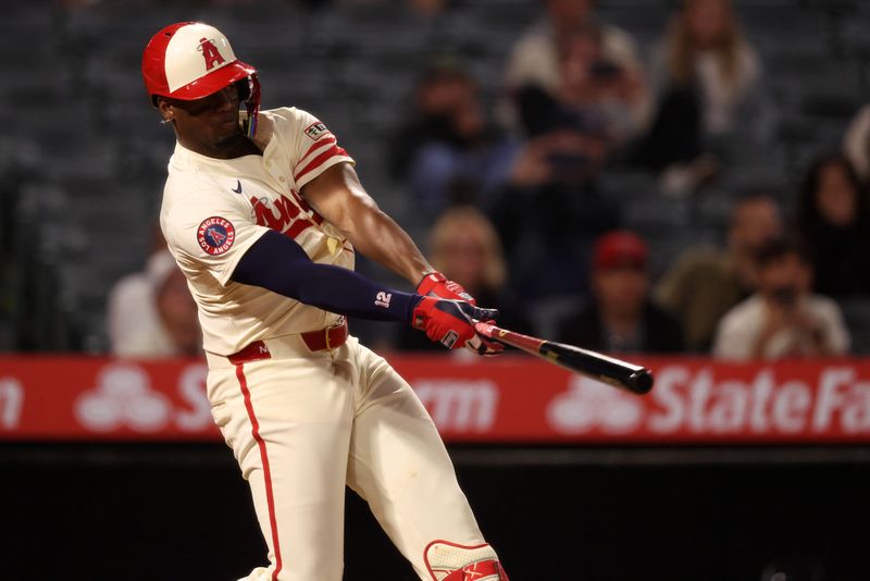May 7, 2025; Anaheim, California, USA;  Los Angeles Angels right fielder Jorge Soler (12) hits a walk-off double during the ninth inning against the Toronto Blue Jays at Angel Stadium. Mandatory Credit: Kiyoshi Mio-Imagn Images