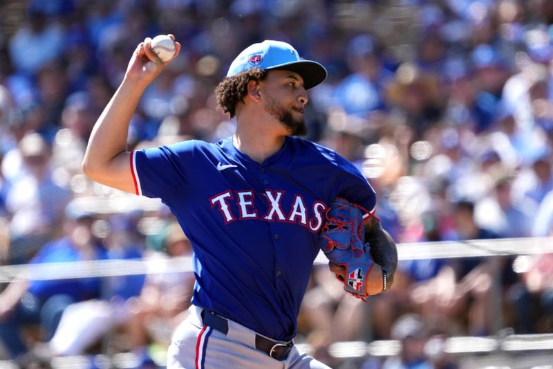 Mar 9, 2024; Phoenix, Arizona, USA; Texas Rangers starting pitcher Yerry Rodriguez (57) pitches against the Los Angeles Dodgers during the first inning at Camelback Ranch-Glendale. Mandatory Credit: Joe Camporeale-USA TODAY Sports