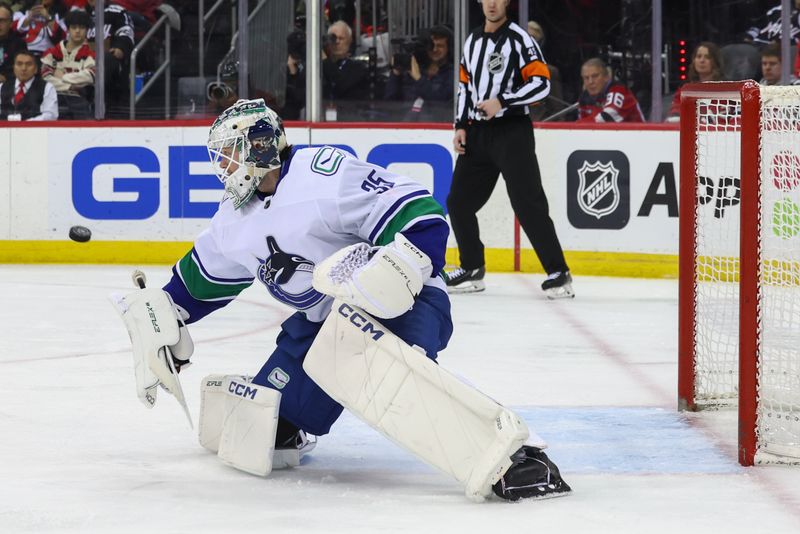 Jan 6, 2024; Newark, New Jersey, USA; Vancouver Canucks goaltender Thatcher Demko (35) makes a save against the New Jersey Devils during the second period at Prudential Center. Mandatory Credit: Ed Mulholland-USA TODAY Sports