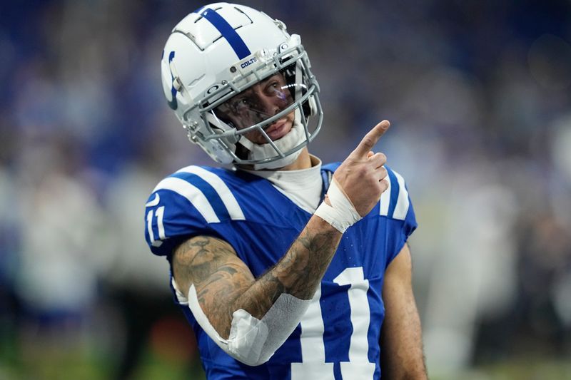 Indianapolis Colts wide receiver Michael Pittman Jr. (11) warms up before an NFL football game against the Houston Texans, Saturday, Jan. 6, 2024, in Indianapolis. (AP Photo/Darron Cummings)