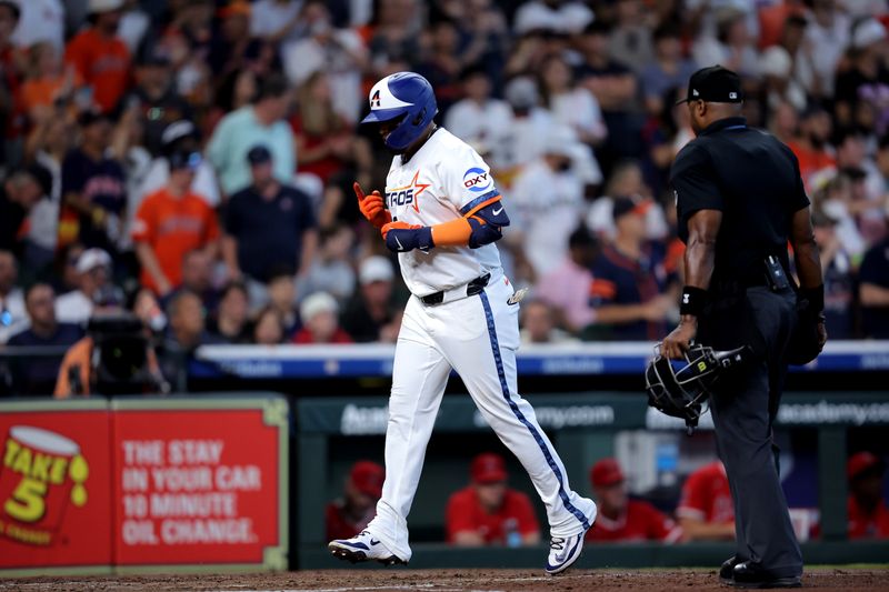 Apr 13, 2025; Houston, Texas, USA; Houston Astros third baseman Isaac Paredes (15) crosses home plate after hitting a three run home run to left field against the Los Angeles Angels during the second inning at Daikin Park. Mandatory Credit: Erik Williams-Imagn Images