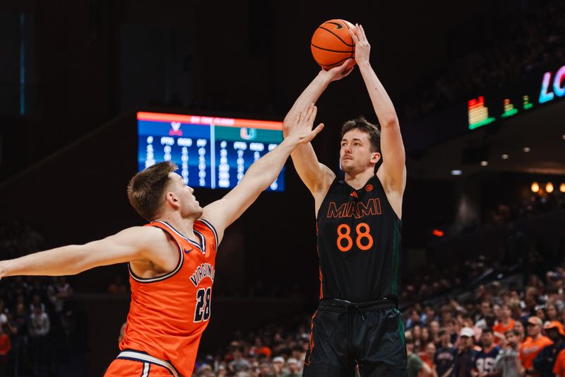 Feb 21, 2026; Charlottesville, Virginia, USA; Miami (FL) Hurricanes forward Timo Malovec (88) shoots the ball while Virginia Cavaliers forward Thijs de Ridder (28) defends during the first half at John Paul Jones Arena. Mandatory Credit: Emily Faith Morgan-Imagn Images