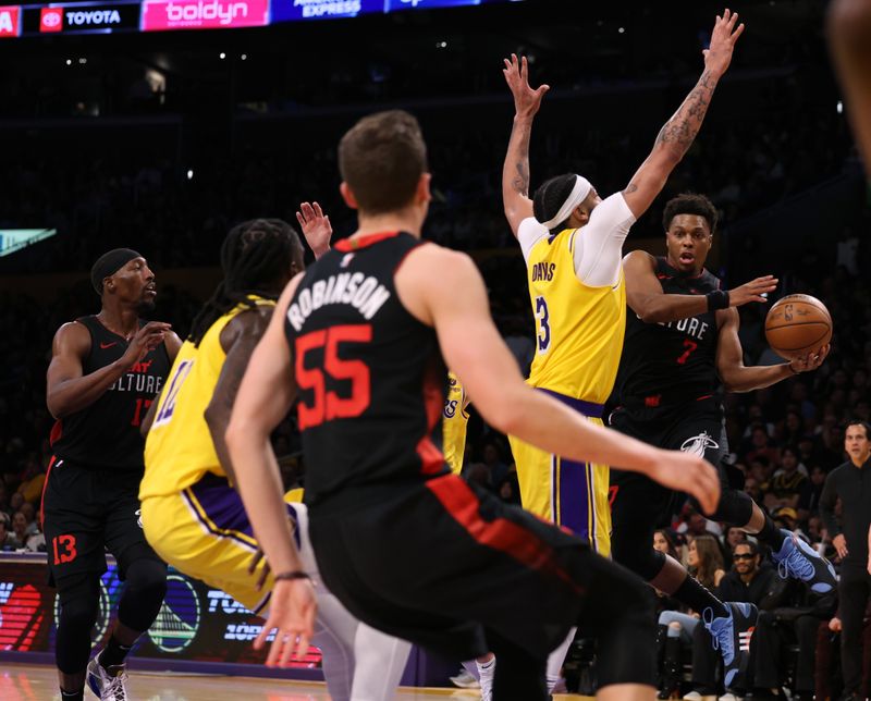 LOS ANGELES, CALIFORNIA - JANUARY 03: Kyle Lowry #7 of the Miami Heat is defended by Anthony Davis #3 of the Los Angeles Lakers during a 110-96 Heat win at Crypto.com Arena on January 03, 2024 in Los Angeles, California. (Photo by Harry How/Getty Images)