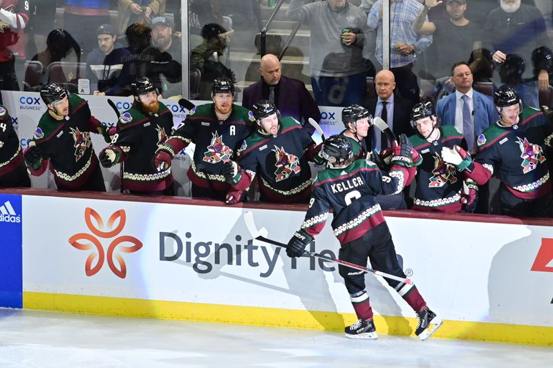 Nov 7, 2023; Tempe, Arizona, USA; Arizona Coyotes right wing Clayton Keller (9) celebrates with teammates after scoring a goal in the third period against the Seattle Kraken at Mullett Arena. Mandatory Credit: Matt Kartozian-USA TODAY Sports