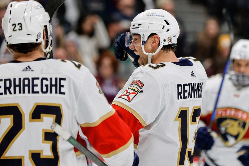 Jan 6, 2024; Denver, Colorado, USA; Florida Panthers center Sam Reinhart (13) celebrates with center Carter Verhaeghe (23) after his hat trick goal in the third period against the Colorado Avalanche at Ball Arena. Mandatory Credit: Isaiah J. Downing-USA TODAY Sports