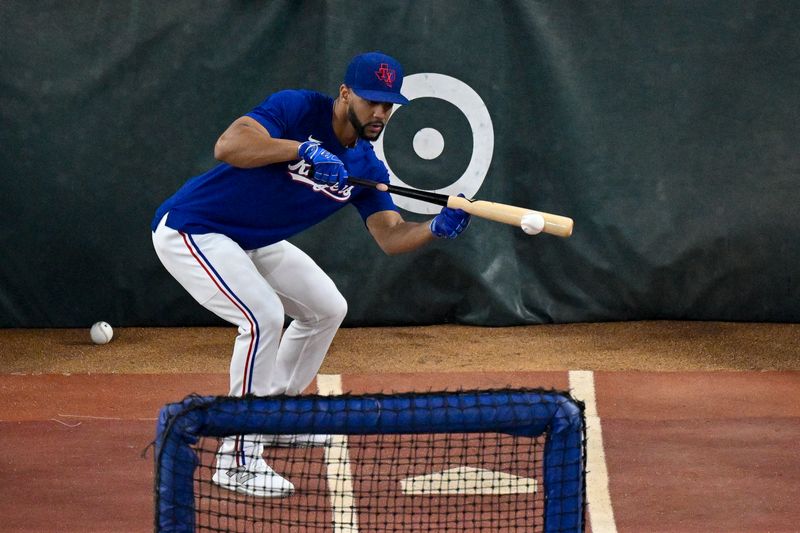 Oct 28, 2023; Arlington, Texas, USA; Texas Rangers center fielder Leody Taveras (3) takes batting practice before the game between the Texas Rangers and the Arizona Diamondbacks in game two of the 2023 World Series at Globe Life Field. Mandatory Credit: Jerome Miron-USA TODAY Sports