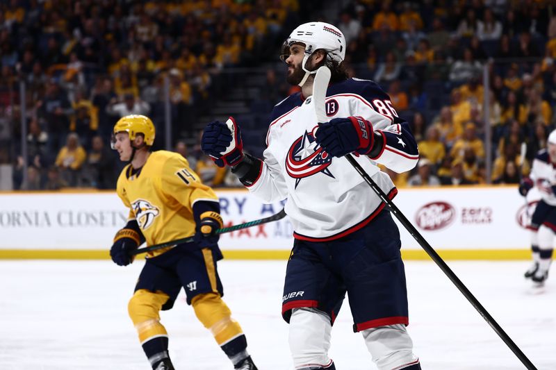 Oct 26, 2024; Nashville, Tennessee, USA; Columbus Blue Jackets right wing Kirill Marchenko (86) celebrates a goal in the second period agains the Nashville Predators at Bridgestone Arena. Mandatory Credit: Casey Gower-Imagn Images