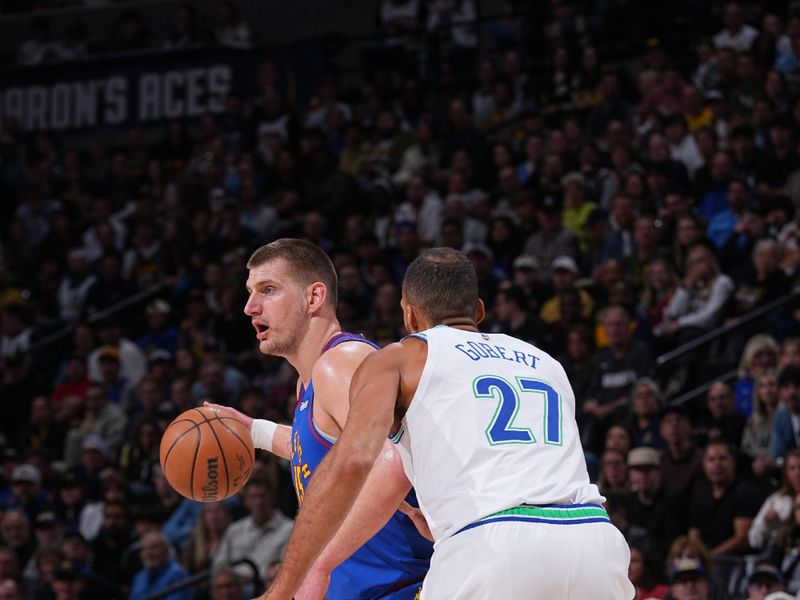 DENVER, CO - MARCH 29: Nikola Jokic #15 of the Denver Nuggets dribbles the ball during the game against the Minnesota Timberwolves on March 29, 2024 at the Ball Arena in Denver, Colorado. NOTE TO USER: User expressly acknowledges and agrees that, by downloading and/or using this Photograph, user is consenting to the terms and conditions of the Getty Images License Agreement. Mandatory Copyright Notice: Copyright 2024 NBAE (Photo by Bart Young/NBAE via Getty Images)