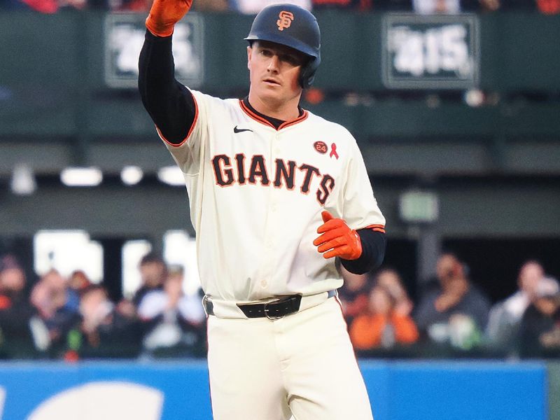 Jul 31, 2024; San Francisco, California, USA; San Francisco Giants third baseman Matt Chapman (26) salutes his teammates after hitting a double against the Oakland Athletics during the second inning at Oracle Park. Mandatory Credit: Kelley L Cox-USA TODAY Sports