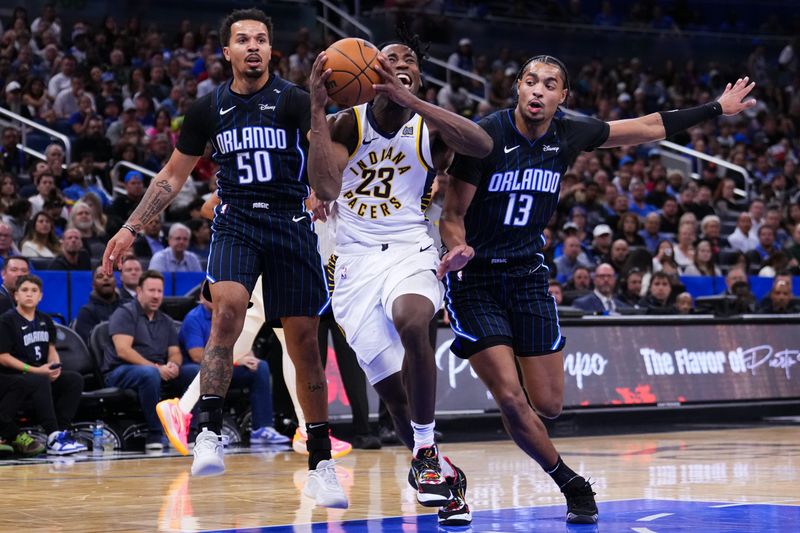 ORLANDO, FLORIDA - OCTOBER 28: Jett Howard #13 of the Orlando Magic fouls Aaron Nesmith #23 of the Indiana Pacers during the third quarter at Kia Center on October 28, 2024 in Orlando, Florida. NOTE TO USER: User expressly acknowledges and agrees that, by downloading and or using this photograph, User is consenting to the terms and conditions of the Getty Images License Agreement. (Photo by Rich Storry/Getty Images)