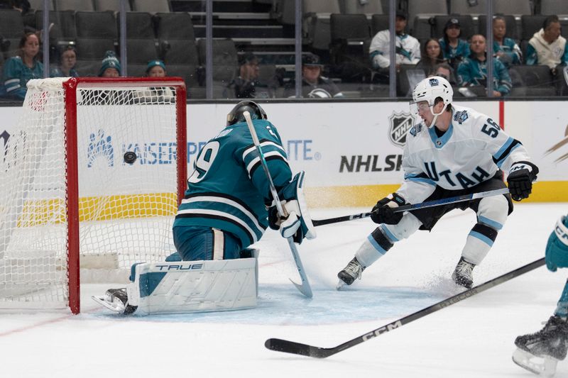 Oct 1, 2024; San Jose, California, USA;  Utah Hockey Club forward Kailer Yamamoto (56) shoots the puck past San Jose Sharks goaltender Mackenzie Blackwood (29) during the third period at SAP Center at San Jose. Mandatory Credit: Stan Szeto-Imagn Images
