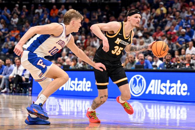 Mar 14, 2025; Nashville, TN, USA;  Missouri Tigers guard Jacob Crews (35) drives to the basket past Florida Gators forward Thomas Haugh (10) during the second half at Bridgestone Arena. Mandatory Credit: Steve Roberts-Imagn Images