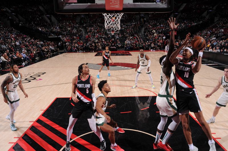 PORTLAND, OR - MARCH 11: Moses Brown #10 of the Portland Trail Blazers drives to the basket during the game against the Boston Celtics on March 11, 2024 at the Moda Center Arena in Portland, Oregon. NOTE TO USER: User expressly acknowledges and agrees that, by downloading and or using this photograph, user is consenting to the terms and conditions of the Getty Images License Agreement. Mandatory Copyright Notice: Copyright 2024 NBAE (Photo by Cameron Browne/NBAE via Getty Images)