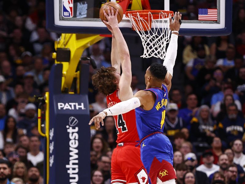 DENVER, COLORADO - MARCH 24:  Russell Westbrook #4 of the Denver Nuggets defends at the rim against Matas Buzelis #14 of the Chicago Bulls at Ball Arena on March 24, 2025 in Denver, Colorado. NOTE TO USER: User expressly acknowledges and agrees that, by downloading and or using this photograph, User is consenting to the terms and conditions of the Getty Images License Agreement. (Photo by Isaac Wasserman/Clarkson Creative/Getty Images)