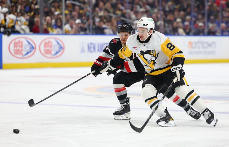 Feb 5, 2026; Buffalo, New York, USA;  Pittsburgh Penguins right wing Avery Hayes (85) goes after a loose puck during the first period against the Buffalo Sabres at KeyBank Center. Mandatory Credit: Timothy T. Ludwig-Imagn Images