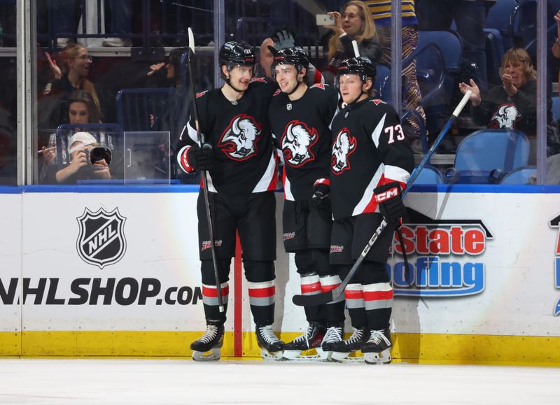 Jan 10, 2026; Buffalo, New York, USA;  Buffalo Sabres right wing Jack Quinn (22) celebrates his goal with teammates during the first period against the Anaheim Ducks at KeyBank Center. Mandatory Credit: Timothy T. Ludwig-Imagn Images