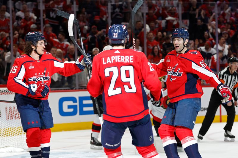 Apr 7, 2024; Washington, District of Columbia, USA; Washington Capitals left wing Max Pacioretty (67) celebrates with teammates after scoring a goal against the Ottawa Senators in the first period at Capital One Arena. Mandatory Credit: Geoff Burke-USA TODAY Sports