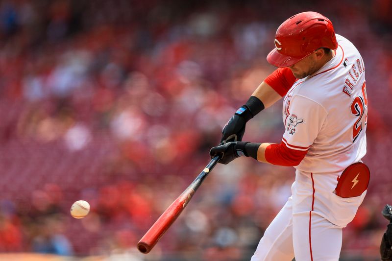 Aug 4, 2024; Cincinnati, Ohio, USA; Cincinnati Reds outfielder TJ Friedl (29) hits a single against the San Francisco Giants in the ninth inning at Great American Ball Park. Mandatory Credit: Katie Stratman-USA TODAY Sports