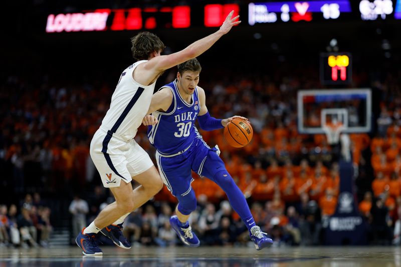 Feb 11, 2023; Charlottesville, Virginia, USA; Duke Blue Devils center Kyle Filipowski (30) drives to the basket as Virginia Cavaliers forward Ben Vander Plas (5) defends in the first half at John Paul Jones Arena. Mandatory Credit: Geoff Burke-USA TODAY Sports