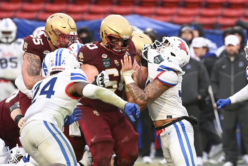 Dec 28, 2023; Boston, MA, USA; Boston College Eagles offensive lineman Kyle Hergel (60) blocks Southern Methodist Mustangs linebacker Ahmad Walker (34) during the second half at Fenway Park. Mandatory Credit: Eric Canha-USA TODAY Sports