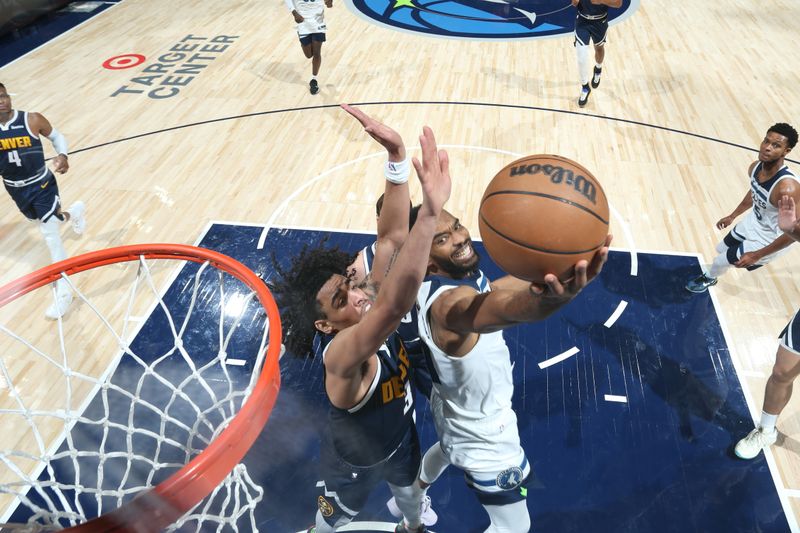 MINNEAPOLIS, MN -  OCTOBER 17: Keita Bates-Diop #31 of the Minnesota Timberwolves drives to the basket during the game against the Denver Nuggets during the 2024 NBA Preseason on October 17, 2024 at Target Center in Minneapolis, Minnesota. NOTE TO USER: User expressly acknowledges and agrees that, by downloading and or using this Photograph, user is consenting to the terms and conditions of the Getty Images License Agreement. Mandatory Copyright Notice: Copyright 2024 NBAE (Photo by David Sherman/NBAE via Getty Images)