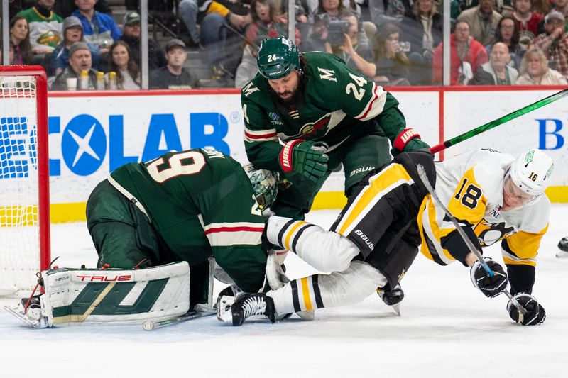 Feb 9, 2024; Saint Paul, Minnesota, USA; Minnesota Wild goaltender Marc-Andre Fleury (29) makes the save while Minnesota Wild defenseman Zach Bogosian (24) moves Pittsburgh Penguins right wing Jesse Puljujarvi (18) out of the way in the third period at Xcel Energy Center. Mandatory Credit: Matt Blewett-USA TODAY Sports