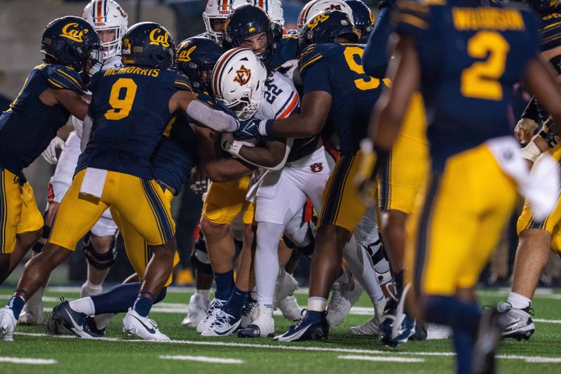 Sep 9, 2023; Berkeley, California, USA; Auburn Tigers running back Damari Alston (22) rushes with the football against California Golden Bears defensive back Patrick McMorris (9) during the fourth quarter at California Memorial Stadium. Mandatory Credit: Neville E. Guard-USA TODAY Sports