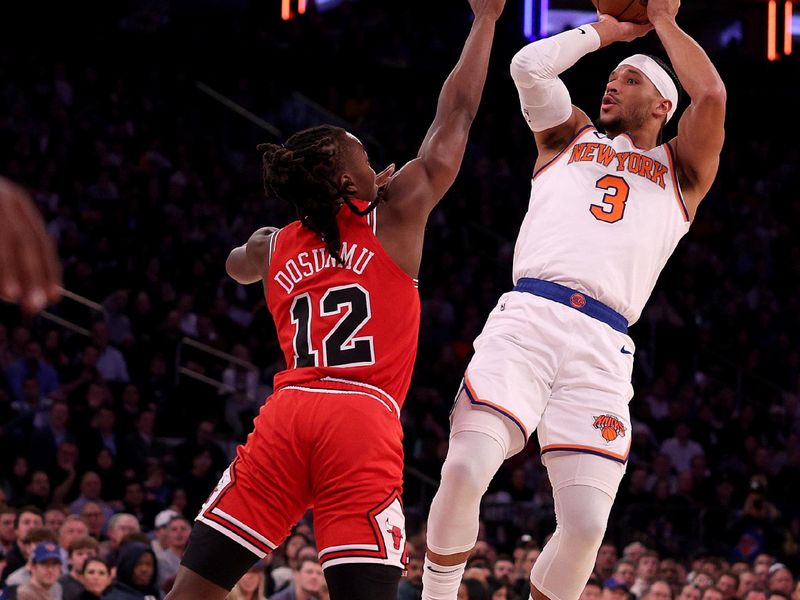 NEW YORK, NEW YORK - JANUARY 03: Josh Hart #3 of the New York Knicks takes a shot as Ayo Dosunmu #12 of the Chicago Bulls defends during the first half at Madison Square Garden on January 03, 2024 in New York City. NOTE TO USER: User expressly acknowledges and agrees that, by downloading and or using this photograph, User is consenting to the terms and conditions of the Getty Images License Agreement. (Photo by Elsa/Getty Images)