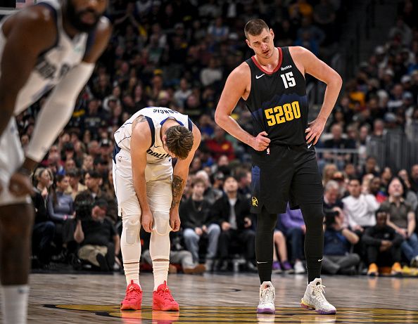 DENVER, CO - DECEMBER 18: Nikola Jokic (15) of the Denver Nuggets talks to Luka Doncic (77) of the Dallas Mavericks during the second quarter at Ball Arena in Denver on Monday, December 18, 2023. (Photo by AAron Ontiveroz/The Denver Post)