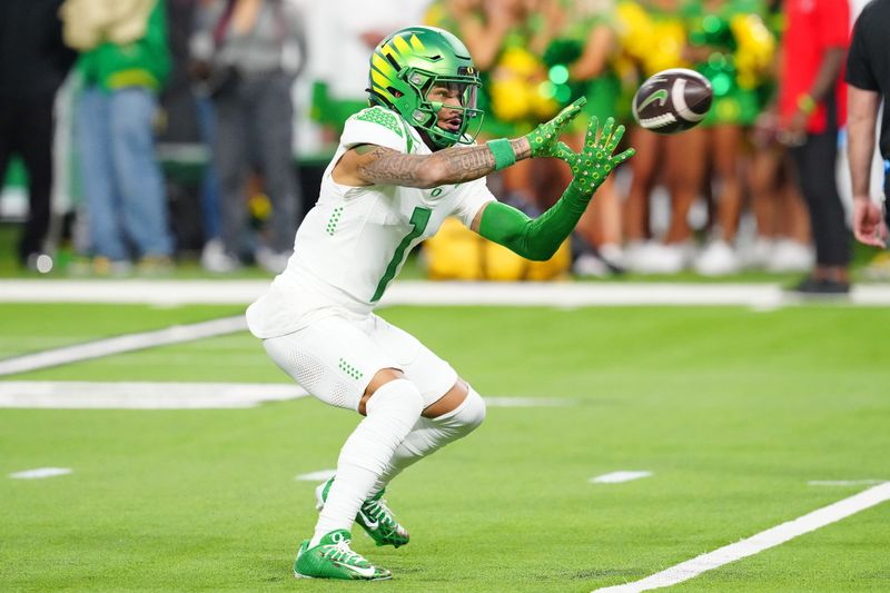 Dec 1, 2023; Las Vegas, NV, USA; Oregon Ducks wide receiver Kris Hutson (1) warms up before a game against the Washington Huskies at Allegiant Stadium. Mandatory Credit: Stephen R. Sylvanie-USA TODAY Sports